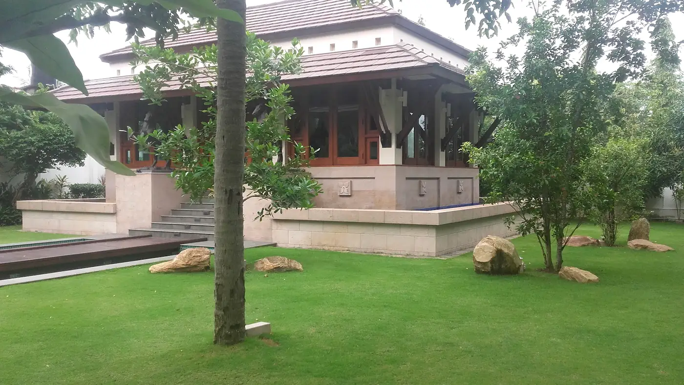 Garden gazebo set among shrubs and lawn at a Colombo residence