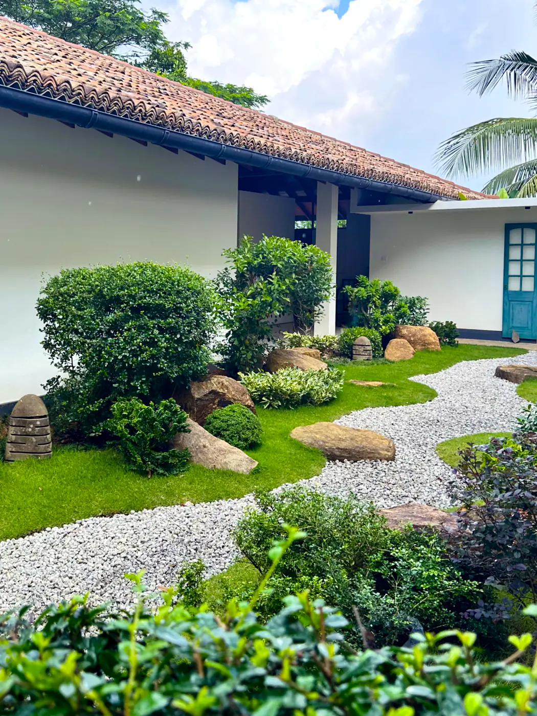 Courtyard garden with rock arrangement and clipped planting