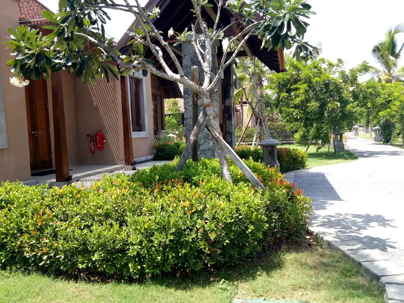 Villa garden with layered tropical planting at Hotel Anantaya, Pasikuda