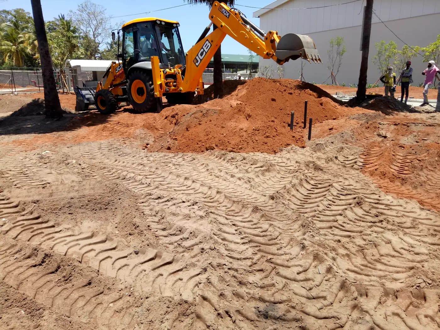 Earthmoving machinery grading the site during land preparation at Brandix Batticaloa